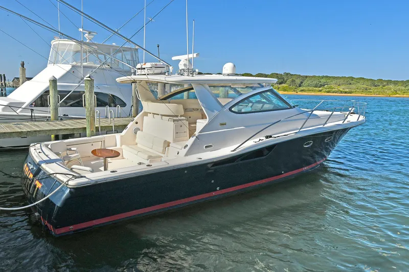 Spirit Yacht Photos Pics 2008 Tiara Yachts 4200 Open docked in a serene marina setting.