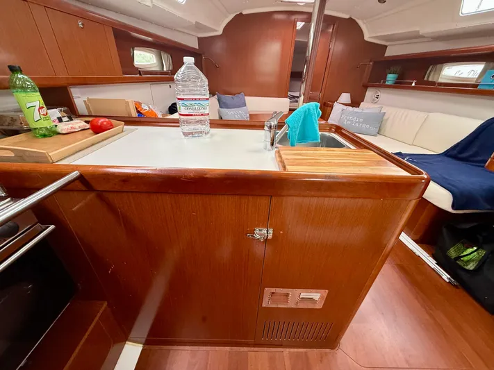  Yacht Photos Pics Interior of 2012 Beneteau Oceanis 37 sailboat with wooden cabinetry and modern amenities.