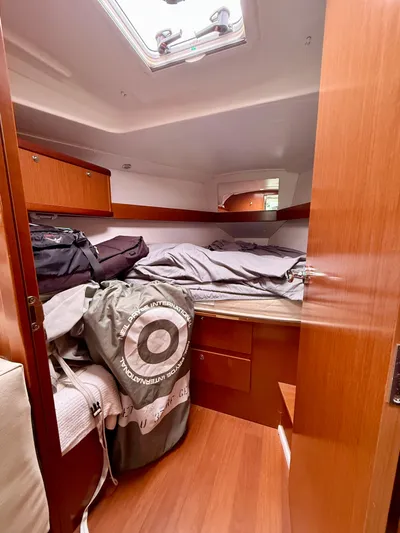  Yacht Photos Pics Cozy cabin interior of 2012 Beneteau Oceanis 37 sailboat with wooden finish.
