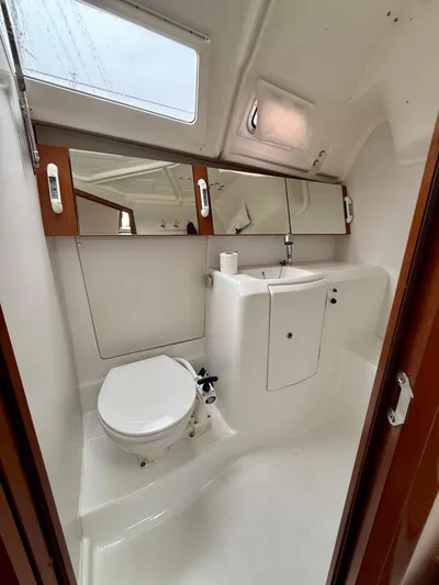  Yacht Photos Pics Beneteau Oceanis 37 bathroom interior, 2012 model, featuring compact design and modern fixtures.