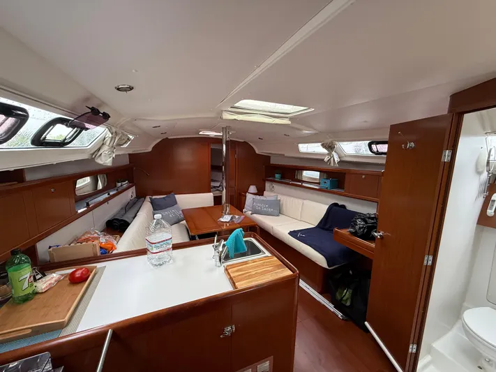  Yacht Photos Pics Interior of 2012 Beneteau Oceanis 37 sailboat with cozy seating and modern amenities.