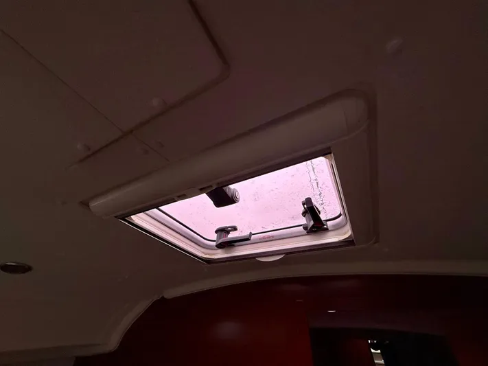  Yacht Photos Pics Ceiling hatch of 2012 Beneteau Oceanis 37 sailboat interior.