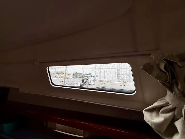  Yacht Photos Pics Interior view of 2012 Beneteau Oceanis 37 sailboat cabin window.