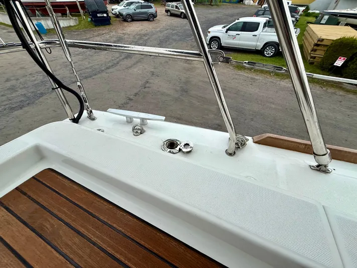  Yacht Photos Pics Beneteau Oceanis 37 yacht deck, 2012 model, featuring stainless steel railings and wooden flooring.