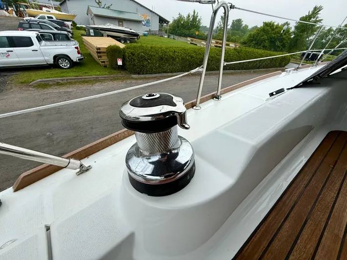  Yacht Photos Pics 2012 Beneteau Oceanis 37 sailboat deck with winch and wooden flooring.