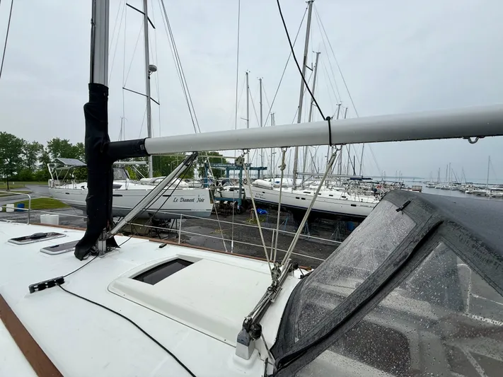  Yacht Photos Pics 2012 Beneteau Oceanis 37 sailboat docked in a marina, overcast sky.