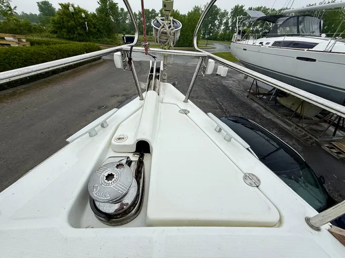  Yacht Photos Pics Bow view of 2012 Beneteau Oceanis 37 sailboat on land, showcasing deck and winch.