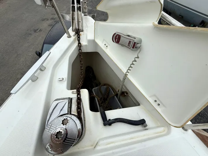  Yacht Photos Pics Anchor locker of 2012 Beneteau Oceanis 37 sailboat with chain and windlass.