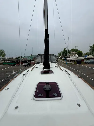  Yacht Photos Pics 2012 Beneteau Oceanis 37 sailboat deck view, docked in a marina.