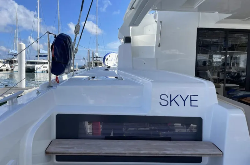 Skye Yacht Photos Pics 2023 Lagoon 50 yacht "SKYE" docked in marina, showcasing sleek design and modern features.