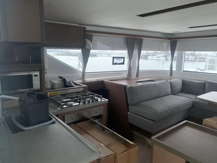 Skye Yacht Photos Pics Interior of 2023 Lagoon 50 yacht with modern kitchen and spacious seating area.