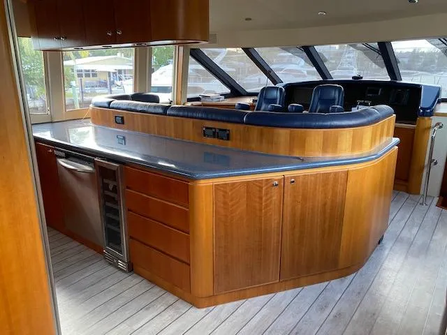 Room Service Yacht Photos Pics Luxurious 2003 West Bay 68 yacht interior with sleek wood cabinetry and modern seating.