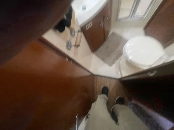  Yacht Photos Pics Interior of a 1999 Carver Voyager bathroom with sink and toilet.