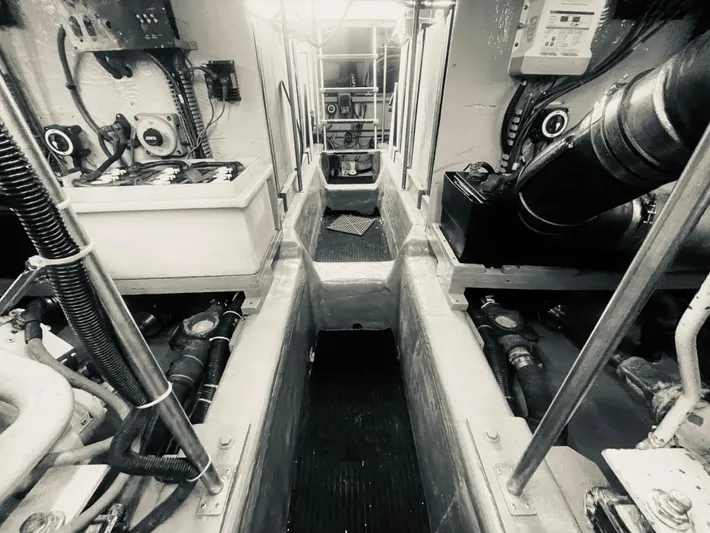  Yacht Photos Pics Engine room of a 1999 Carver Voyager boat, showcasing mechanical components and equipment.