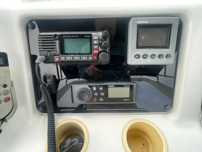  Yacht Photos Pics Control panel of a 1999 Carver Voyager with navigation and communication equipment.