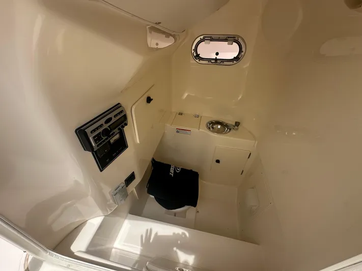  Yacht Photos Pics Interior of 2009 Pursuit C 310 Center Console boat with sink and control panel.