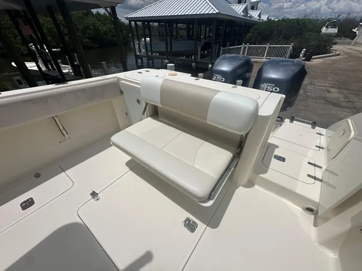  Yacht Photos Pics 2009 Pursuit C 310 Center Console boat with foldable seating and dual Yamaha engines.