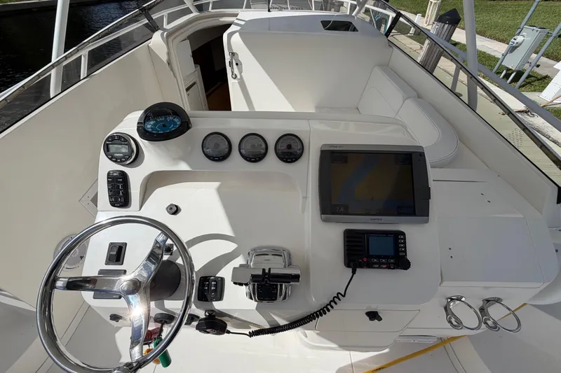 Watch Me Yacht Photos Pics 2008 Intrepid 350 Center Console boat dashboard with steering wheel and navigation instruments.