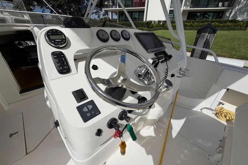 Watch Me Yacht Photos Pics 2008 Intrepid 350 Center Console boat dashboard with steering wheel and controls.