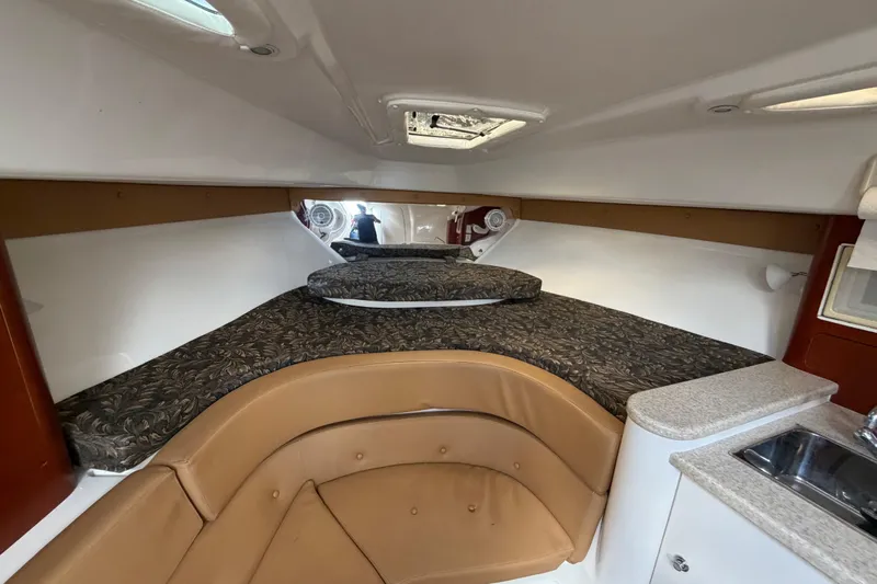 Watch Me Yacht Photos Pics 2008 Intrepid 350 Center Console cabin interior with bed and kitchenette.