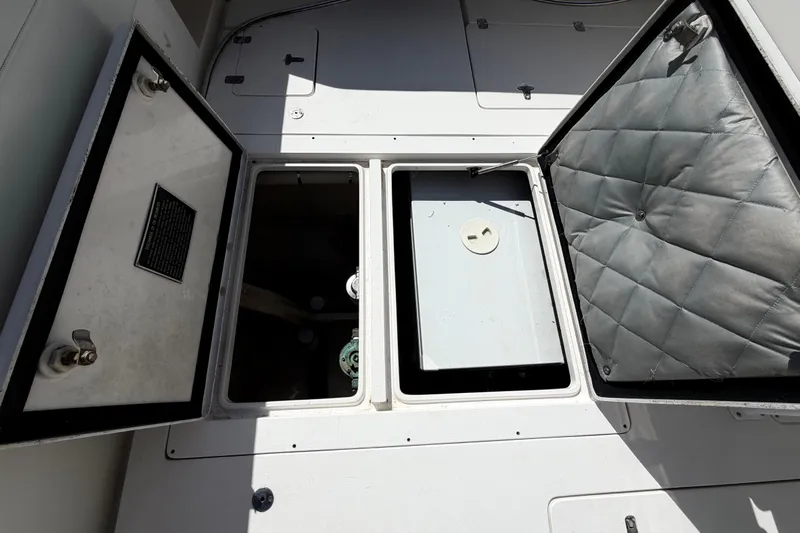 Watch Me Yacht Photos Pics Open storage compartments on a 2008 Intrepid 350 Center Console boat deck.