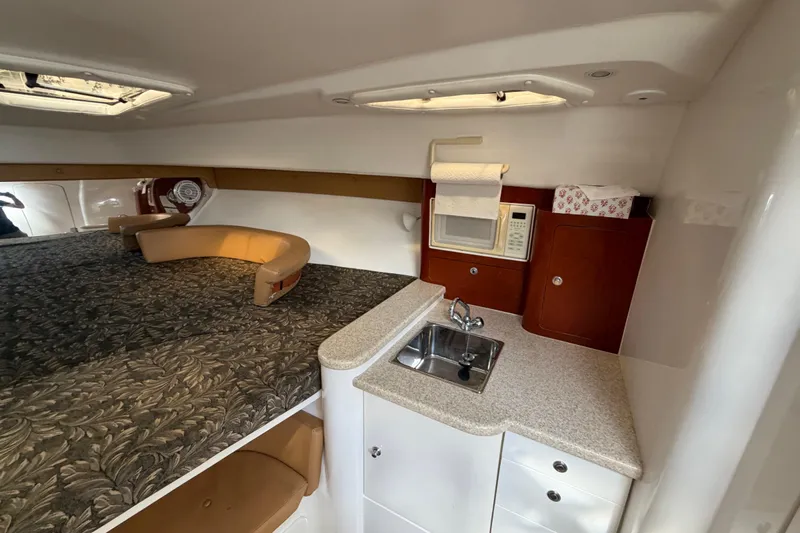 Watch Me Yacht Photos Pics 2008 Intrepid 350 Center Console cabin with kitchenette and cozy seating area.