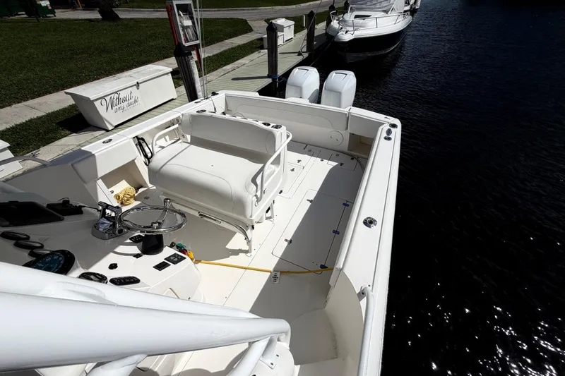 Watch Me Yacht Photos Pics 2008 Intrepid 350 Center Console boat docked, featuring spacious deck and dual outboard engines.