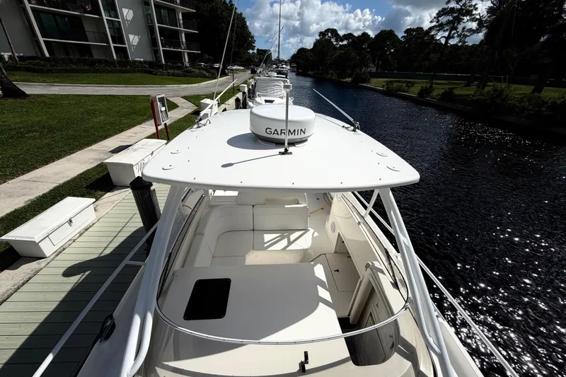 Watch Me Yacht Photos Pics 2008 Intrepid 350 Center Console boat docked by a scenic canal.