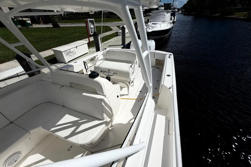Watch Me Yacht Photos Pics 2008 Intrepid 350 Center Console boat docked on a sunny day, showcasing spacious seating.