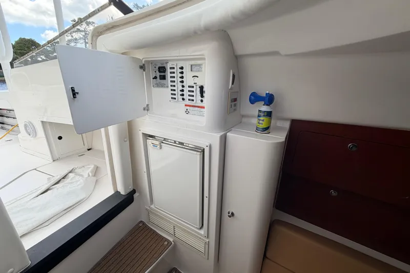 Watch Me Yacht Photos Pics 2008 Intrepid 350 Center Console interior with control panel and storage compartments.