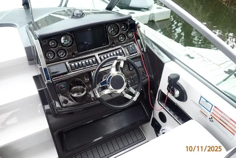  Yacht Photos Pics Cockpit of 2021 Monterey 295 Sport Yacht with modern controls and steering wheel.