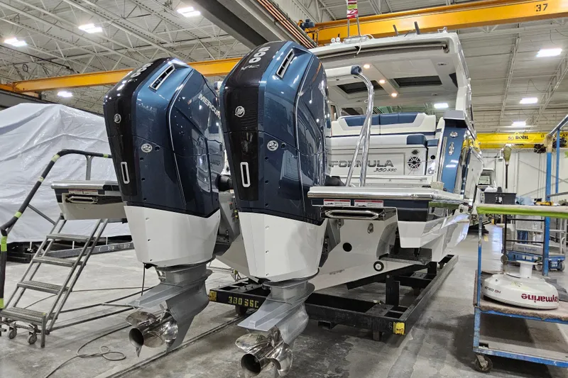  Yacht Photos Pics 2026 Formula 380 Super Sport Crossover OB with dual Mercury outboard engines in a workshop.