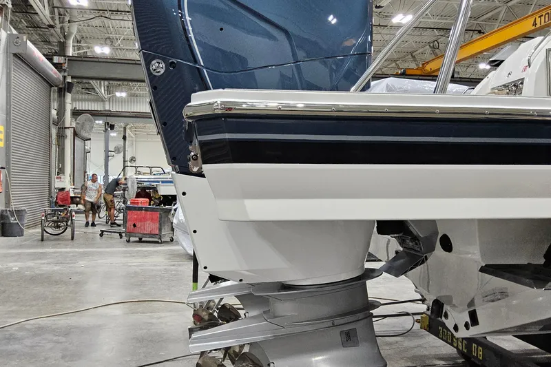  Yacht Photos Pics 2026 Formula 380 Super Sport Crossover OB in a workshop, showcasing its sleek design.