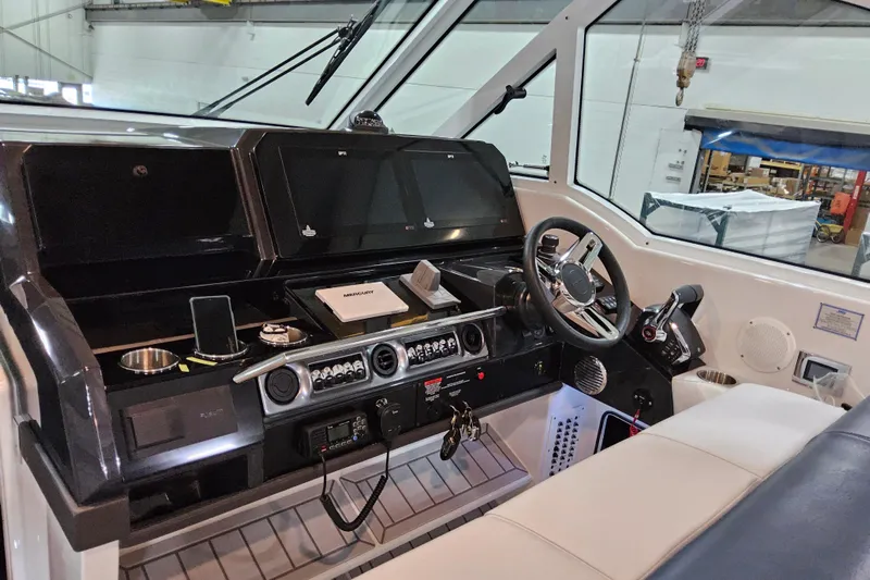  Yacht Photos Pics 2026 Formula 380 Super Sport Crossover OB helm with advanced controls and navigation displays.
