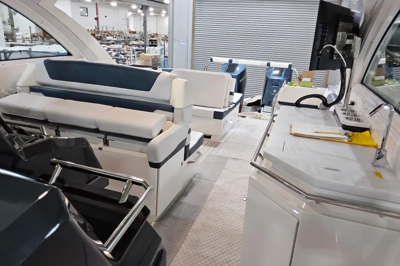  Yacht Photos Pics Interior of 2026 Formula 380 Super Sport Crossover OB, featuring seating and kitchenette.