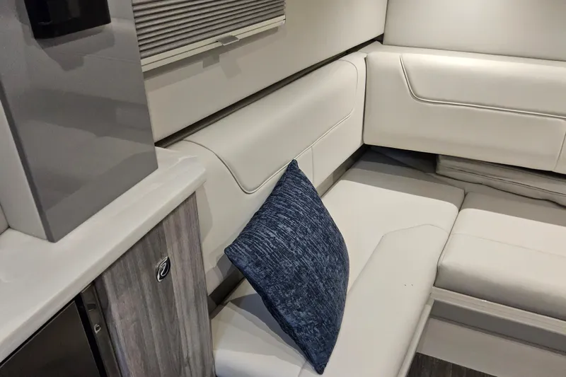  Yacht Photos Pics Luxurious interior of 2026 Formula 380 Super Sport Crossover OB with white seating and blue cushion.