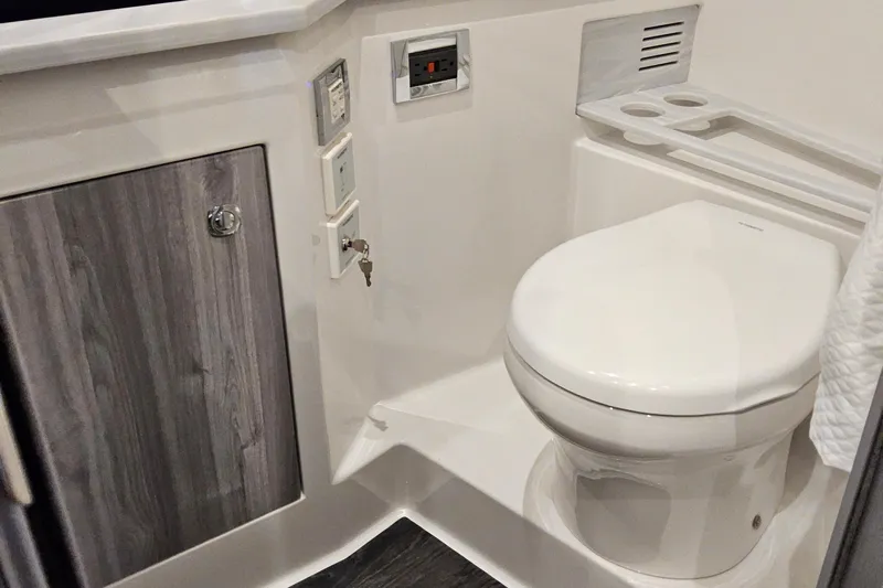  Yacht Photos Pics 2026 Formula 380 Super Sport Crossover OB bathroom with modern fixtures and wood accents.