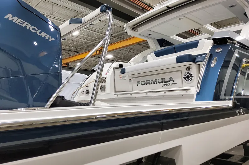  Yacht Photos Pics 2026 Formula 380 Super Sport Crossover OB boat with Mercury engine in showroom.