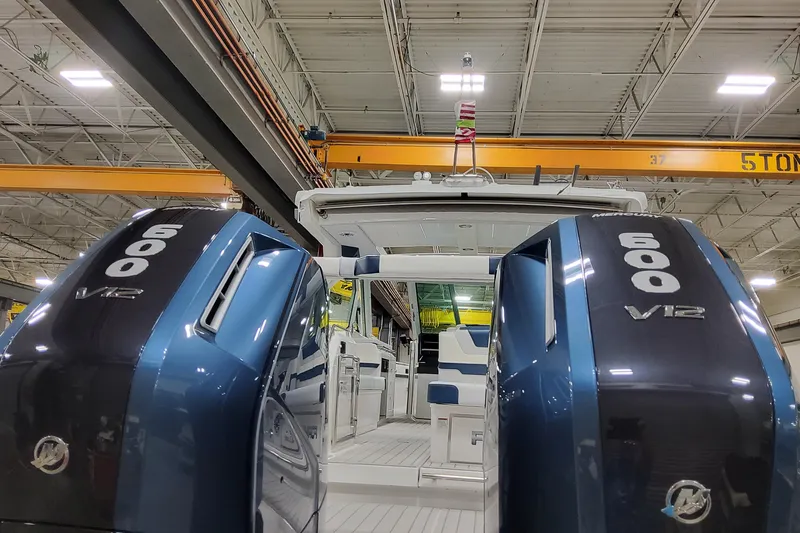  Yacht Photos Pics 2026 Formula 380 Super Sport Crossover OB with dual 600 V12 engines in a warehouse.