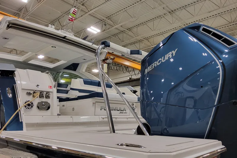  Yacht Photos Pics 2026 Formula 380 Super Sport Crossover OB with Mercury engine in a showroom.