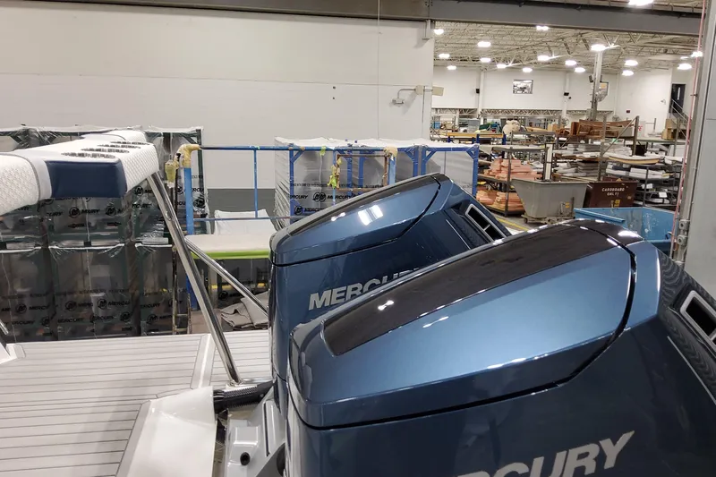  Yacht Photos Pics 2026 Formula 380 Super Sport Crossover OB with Mercury engines in a manufacturing facility.