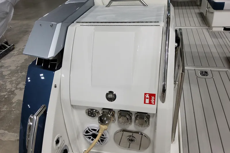  Yacht Photos Pics 2026 Formula 380 Super Sport Crossover OB boat deck with modern fittings and fire safety sign.