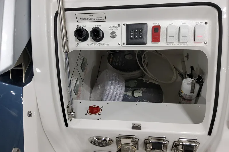  Yacht Photos Pics Control panel of 2026 Formula 380 Super Sport Crossover OB boat, featuring switches and storage.