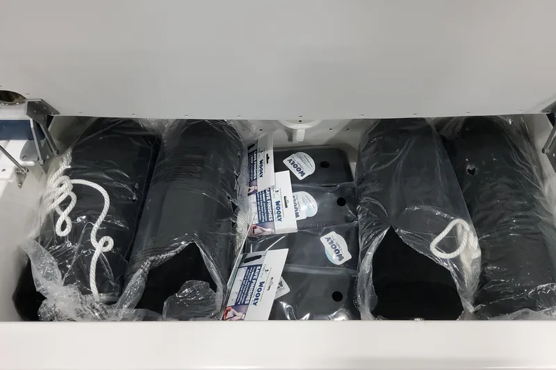  Yacht Photos Pics Storage compartment with packaged boat fenders and ropes in a 2026 Formula 380 Super Sport Crossover OB.