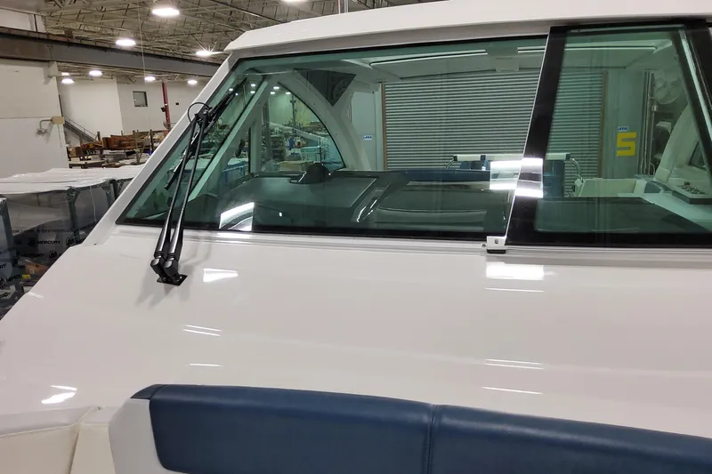 Yacht Photos Pics 2026 Formula 380 Super Sport Crossover OB boat windshield and wiper detail in a showroom.