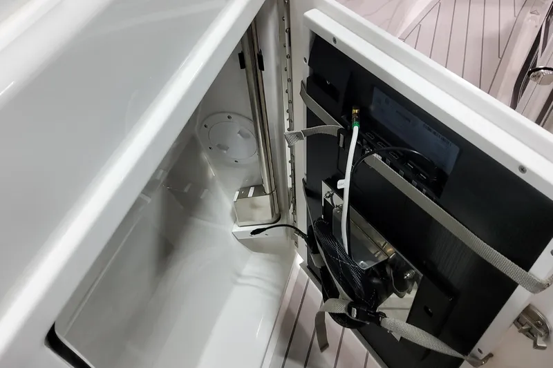  Yacht Photos Pics Interior view of 2026 Formula 380 Super Sport Crossover OB, showcasing storage compartment and wiring.