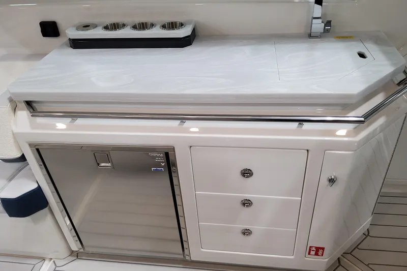 Yacht Photos Pics 2026 Formula 380 Super Sport Crossover OB boat interior with sleek kitchenette and storage.