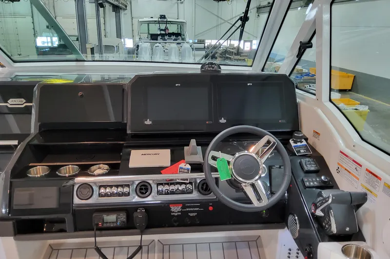  Yacht Photos Pics 2026 Formula 380 Super Sport Crossover OB helm with modern controls and navigation displays.