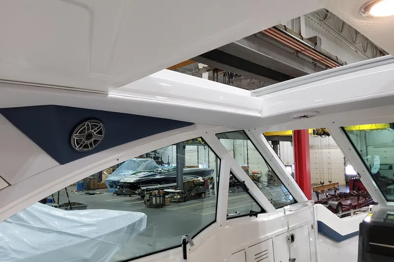  Yacht Photos Pics Interior view of 2026 Formula 380 Super Sport Crossover OB boat in a workshop.