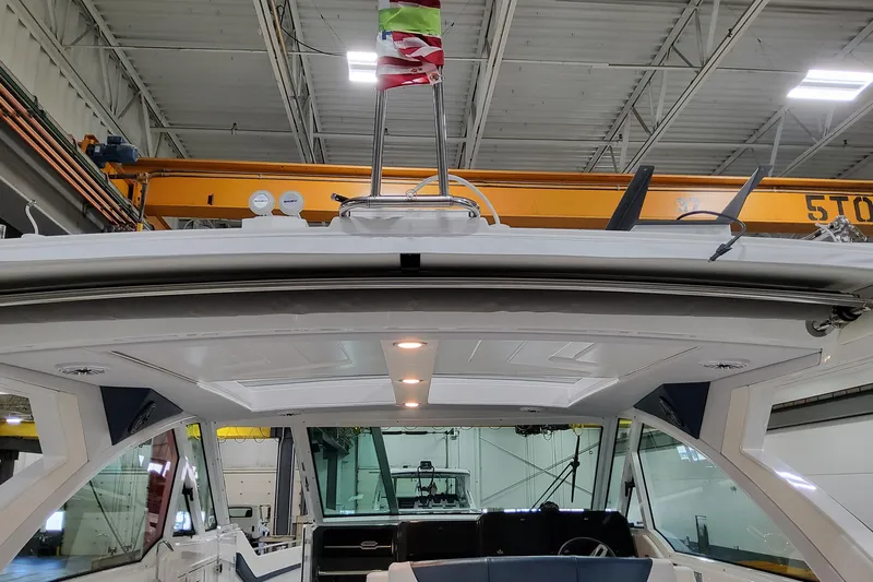  Yacht Photos Pics 2026 Formula 380 Super Sport Crossover OB in a warehouse, showcasing sleek design and modern features.